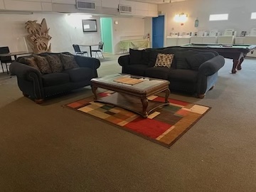 Windswept RV Park amenities — large-screen TV lounge